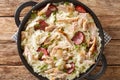 Chicken bog is a delicious chicken, rice and sausage dish closeup in the pan. Horizontal top view Royalty Free Stock Photo