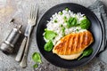 Chicken breast or fillet, poultry meat grilled and boiled white rice with green peas and fresh spinach leaves Royalty Free Stock Photo