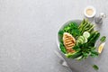 Chicken breast grilled, broccoli with asparagus and fresh green vegetables, spinach leaves in lunch bowl, healthy food, top view Royalty Free Stock Photo