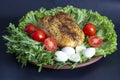 chicken breast on lettuce leaves with tomatoes and quail eggs Royalty Free Stock Photo