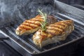 Chicken Breast with rosemary in pan Royalty Free Stock Photo