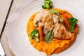 Chicken breast steak with carrot puree baby carrot and broccoli. Grilled chicken slice with baby carrot puree. wooden Royalty Free Stock Photo