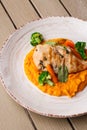 Chicken breast steak with carrot puree baby carrot and broccoli. Grilled chicken slice with baby carrot puree. wooden Royalty Free Stock Photo