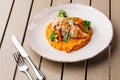 Chicken breast steak with carrot puree baby carrot and broccoli. Grilled chicken slice with baby carrot puree. wooden Royalty Free Stock Photo