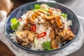 Chicken breasts with mushrooms, served with rice, chilli and parsley