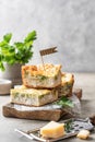 Chicken broccoli cheesy sliced casserole on wooden board on gray background with text space. Healthy food Royalty Free Stock Photo