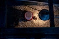 Young chicks inside a chicken brooder cage with a heat lamp, wood shaving bedding, food and water Royalty Free Stock Photo