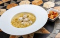 Chicken broth with meatballs and farfallina Royalty Free Stock Photo