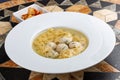 Chicken broth with meatballs and farfallina Royalty Free Stock Photo
