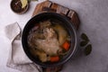 Chicken broth soup or bouillon in pan Royalty Free Stock Photo