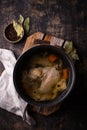Chicken broth soup or bouillon in pan Royalty Free Stock Photo