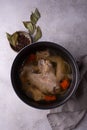Chicken broth soup or bouillon in pan Royalty Free Stock Photo