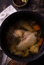 Chicken broth soup or bouillon in pan Royalty Free Stock Photo