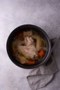 Chicken broth soup or bouillon in pan Royalty Free Stock Photo
