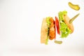 Chicken burger flying in the air on light background