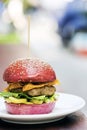 Chicken burger with gherkins beetroot bread bun