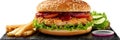 Chicken burger isolated, hamburger on black plate, chickenburger with onions, tomato sauce Royalty Free Stock Photo