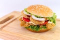 Chicken burger serve on Chopping Wood