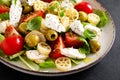 Chicken Caprese pasta salad with mozzarella cheese, olives, tomato and fresh basil Royalty Free Stock Photo