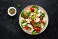 Chicken Caprese pasta salad with mozzarella cheese, olives, tomato and fresh basil. Top view, flat lay Royalty Free Stock Photo