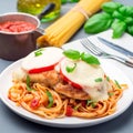 Chicken caprese with tomato and mozzarella cheese, served with linguine, tomato pasta sauce and basil, square Royalty Free Stock Photo