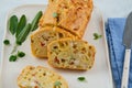 Chicken, cheese and pepper muffin on light grey background. Savory muffin. Healthy lunch or snack.