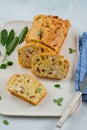 Chicken, cheese and pepper muffin on light grey background. Savory muffin. Healthy lunch or snack.