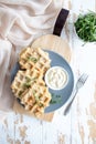 Chicken and cheese waffles with sour cream sauce