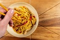 Chicken chow mein and chopsticks on wooden table Royalty Free Stock Photo