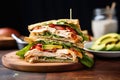 chicken club sandwich with thinly sliced chicken and avocado