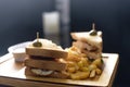 Chicken club sandwich on a white plate with spicy french fries. Royalty Free Stock Photo