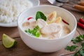Chicken with coconut milk soup in bowl and rice, Thai food Tom Kha Kai