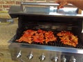 Chicken cooking on an outdoor grill