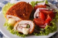 Chicken cordon bleu and vegetable salad closeup. horizontal