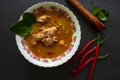 Chicken curry or kari ayam served on bowl, isolated on white background. Royalty Free Stock Photo
