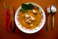 Chicken curry or kari ayam served on bowl, isolated on white background. Royalty Free Stock Photo