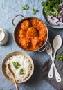 Chicken curry sauce meatballs and rice on a blue background, top view. Indian food. Healthy food Royalty Free Stock Photo