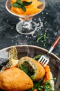 Chicken Cutlet with mashed potatoes and pumpkin. Cutlet in Kiev decorated asparagus and peas. vertical image. top view. place for Royalty Free Stock Photo