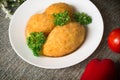 Chicken cutlets on Kiev. Old background. Top view. Close-up Royalty Free Stock Photo