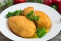 Chicken cutlets on Kiev. Old background. Top view. Close-up Royalty Free Stock Photo