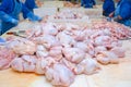 Chicken. Cutting shop of a poultry farm. Butcher is chopping a c