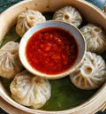 Chicken Dimsums Or Momos Served With Sauce