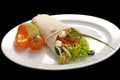 Chicken doner kebab and fresh vegetables in roll of pita bread lavash Royalty Free Stock Photo