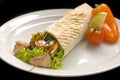 Chicken doner kebab and fresh vegetables in roll of pita bread lavash Royalty Free Stock Photo