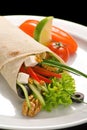 Chicken doner kebab and fresh vegetables in roll of pita bread lavash Royalty Free Stock Photo