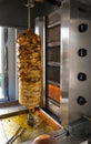 Chicken doner kebab on rotating vertical spit in street in Turkey