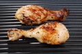 Chicken drumstick on grill Royalty Free Stock Photo