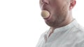 Chicken egg in the mouth of a person, copy space, censorship of the word, covered by the object of the mouth, the person is silent Royalty Free Stock Photo