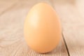 Chicken egg on a wooden table. Close up