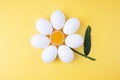 Chicken eggs arranged into a flower shape with exposed egg yolk in the middle and cucumber peel as the stem Royalty Free Stock Photo